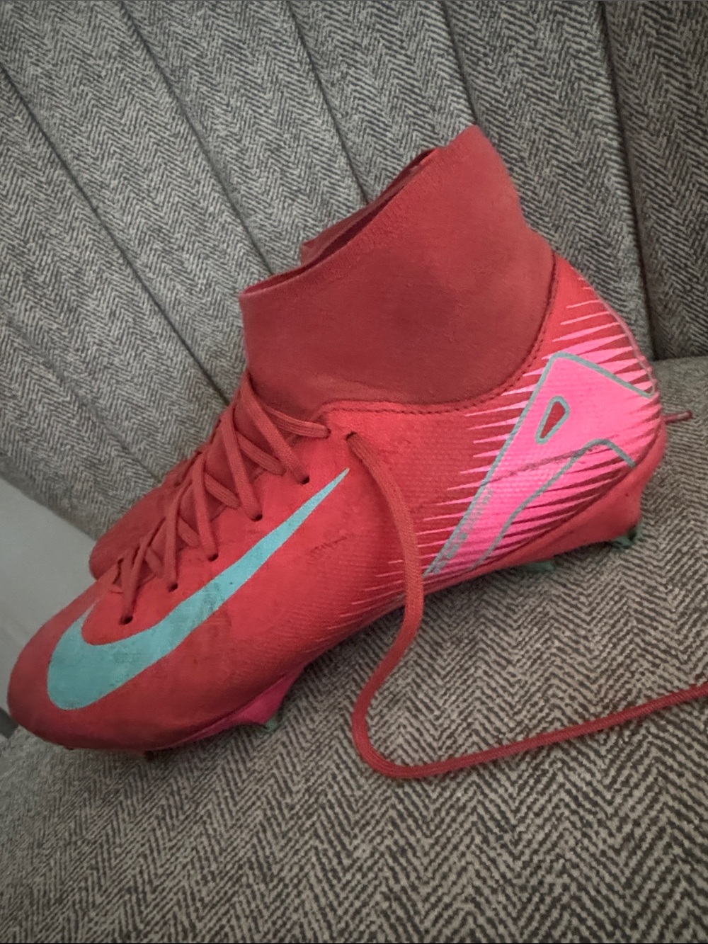 Nike Red Soccer Cleat with Teal and Pink Accents